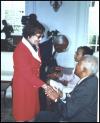 Dr. Rosabelle Seesaran shaking hands with President Robinson